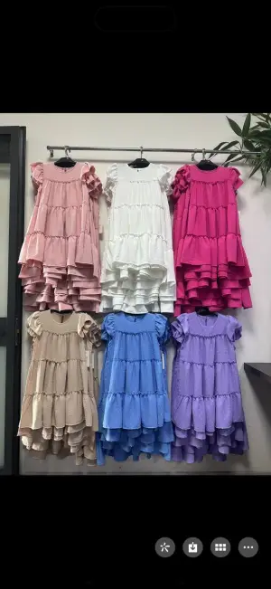 MulherVestidos de distribuidor de roupas JDJ KIDS em Itália